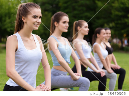 Positive women doing sport exercises 23470306