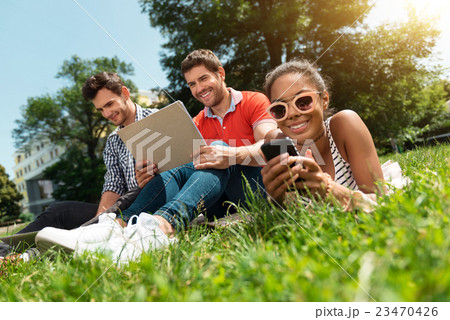 Modern youth relaxing outdoors 23470426