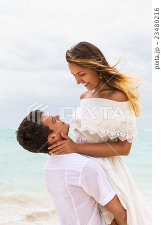 Happy couple in love on the beach 23480216
