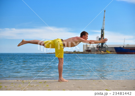 man making yoga exercises 23481442