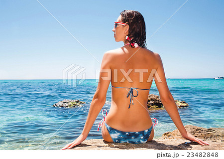Young attractive woman posing on the beach Young attractive woman posing on the beach 23482848