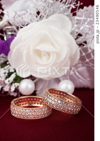 Wedding background with two rings and rose Wedding background with two rings and rose 23490546