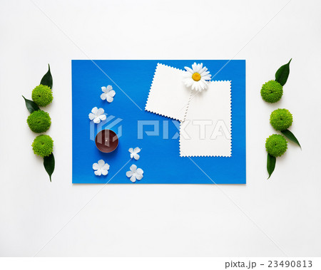 Blue paper with candle and decoration  23490813