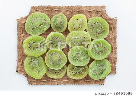 Figured frame made of burlap with dried kiwi 23491099