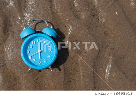Retro alarm clock on sea beach sand. Retro alarm clock on sea beach sand. 23498913