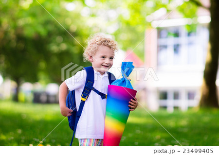 Little child with candy cone on first school day 23499405