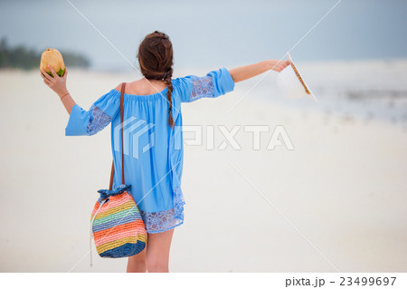 Young beautiful girl on beach vacation Young beautiful girl on beach vacation 23499697