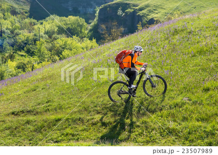 Cyclist on the Beautiful Meadow Trail Cyclist on the Beautiful Meadow Trail 23507989