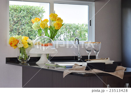 pantry with sink and utensil on granite countertop 23513428