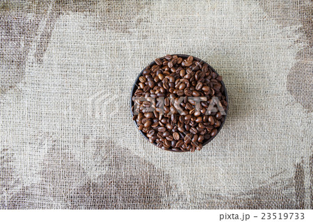 Burlap texture with coffee beans heart shape 23519733