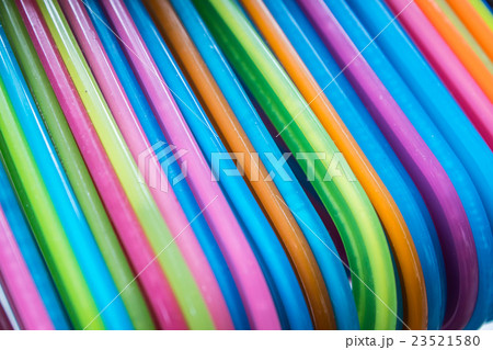set of colorful coat hanger hanging on rail set of colorful coat hanger hanging on rail 23521580