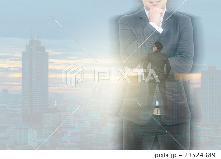 Double exposure of businessman on blurred cityscape background, Business concept Double exposure of businessman on blurred cityscape background, Business concept 23524389