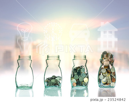 Mix coins and seed in clear bottle on cityscape photo blurred cityscape background with sign shape,Business investment growth concept Mix coins and seed in clear bottle on cityscape photo blurred cityscape background with sign shape,Business investment growth concept 23524842