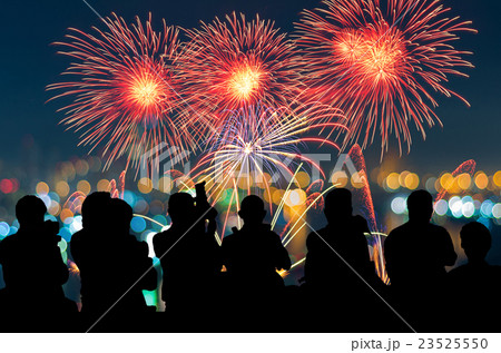 The silhouette of reporter photograph the Fantastic festive new years colorful fireworks on cityscape blurred photo bokeh,project success, holiday concept 23525550