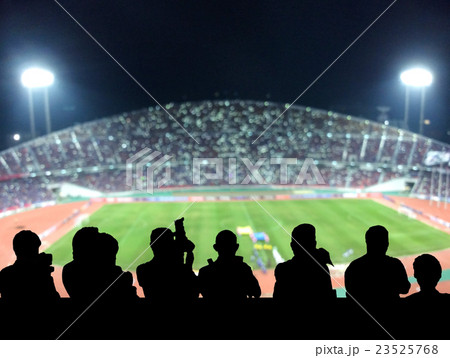 The silhouette of reporter photograph the panorama of Abstract blurred photo of fan sport at stadium, sport background concept The silhouette of reporter photograph the panorama of Abstract blurred photo of fan sport at stadium, sport background concept 23525768