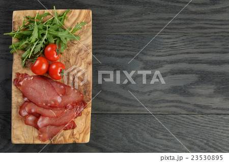 smoked ham prsut with cherry tomatoes and arugula smoked ham prsut with cherry tomatoes and arugula 23530895