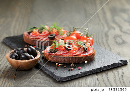 open rye sandwich with salami and vegetables 23531546