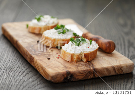 crunchy baguette slices with cream cheese and crunchy baguette slices with cream cheese and 23531751