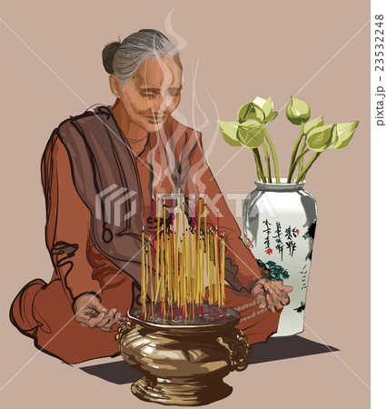 Woman praying in a buddhist temple Woman praying in a buddhist temple 23532248