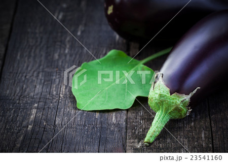 Fresh aubergine on vintage wood background Fresh aubergine on vintage wood background 23541160