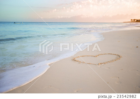 Heart drawn in the sand. Beach background. Top 23542982
