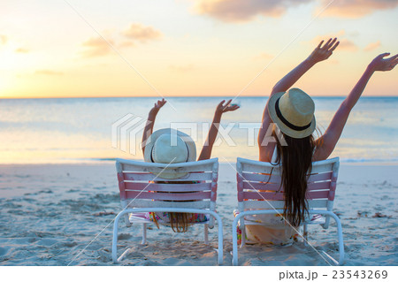 Little girl and young mother on the beach Little girl and young mother on the beach 23543269