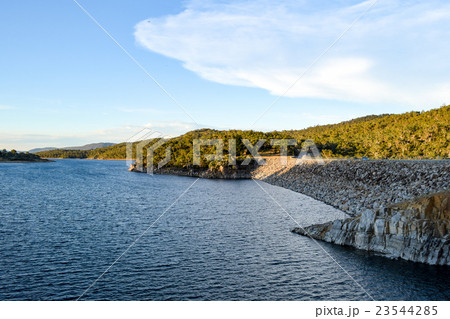 Lake Jindabyne in the shadows of a mountain range 23544285