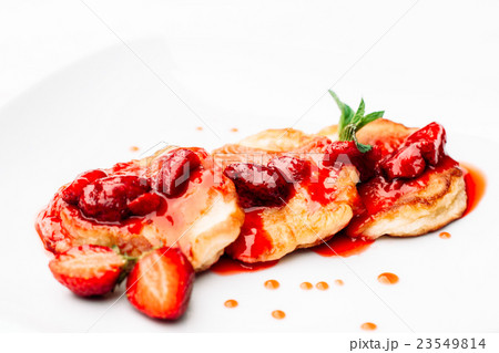 Delicious pancakes with strawberry jam on white Delicious pancakes with strawberry jam on white 23549814