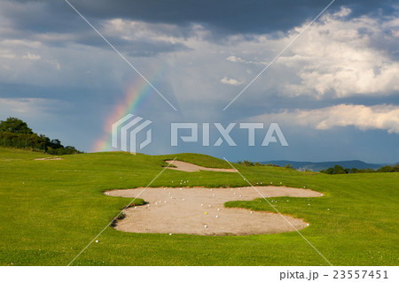 Rainbow on the empty driving range 23557451