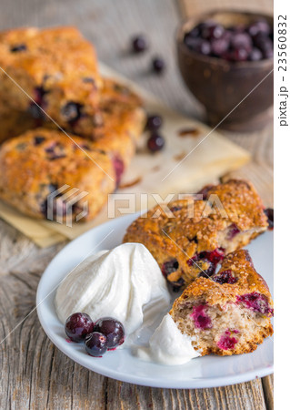 Homemade scones with berries and cream. Homemade scones with berries and cream. 23560832