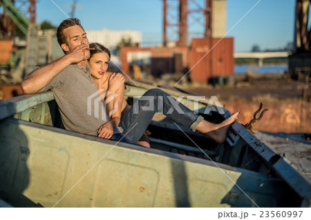 Sexy couple in old boat Sexy couple in old boat 23560997