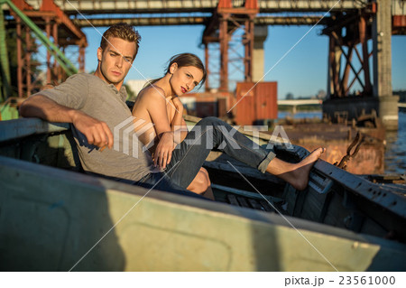 Sexy couple in old boat 23561000