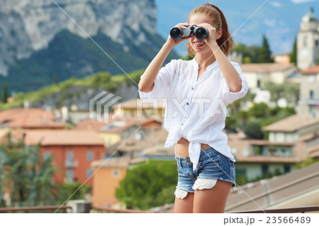 tourist woman looking through binoculars tourist woman looking through binoculars 23566489