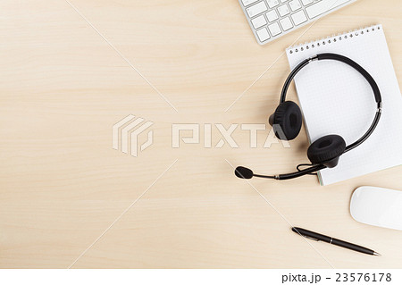 Office desk with headset and pc Office desk with headset and pc 23576178
