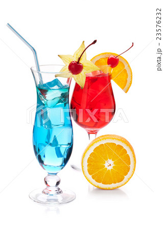 Two tropical cocktails and orange 23576232