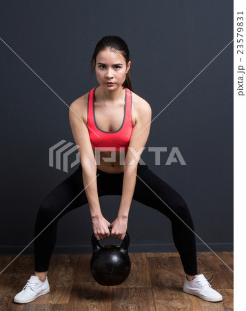 Young fitness woman doing exercise Young fitness woman doing exercise 23579831