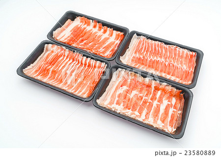 Slide of raw pork on white background . 23580889