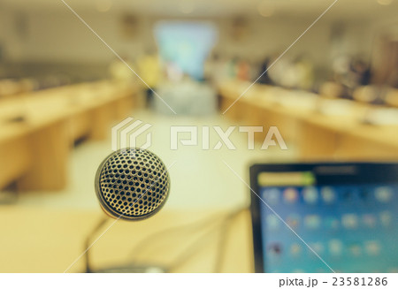 Black microphone in conference room . ( Filtered image processed vintage effect. ) Black microphone in conference room . ( Filtered image processed vintage effect. ) 23581286