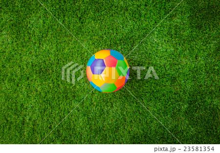 Real leather Colorful multi colour Soccer ball on green grass . 23581354