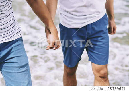 Walking on the beach Walking on the beach 23589691