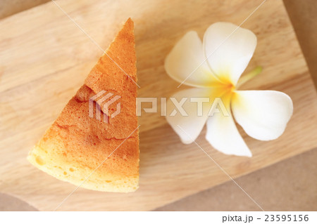 Japanese style Cheesecake, top view on wood plate. Japanese style Cheesecake, top view on wood plate. 23595156