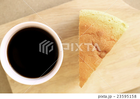 Japanese style Cheesecake and cup of black coffee. 23595158