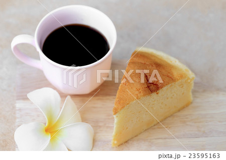 Japanese style Cheesecake and cup of black coffee. Japanese style Cheesecake and cup of black coffee. 23595163