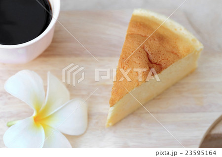 Japanese style Cheesecake and cup of black coffee. Japanese style Cheesecake and cup of black coffee. 23595164