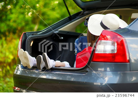 Two little sisters going to a car vacation Two little sisters going to a car vacation 23596744