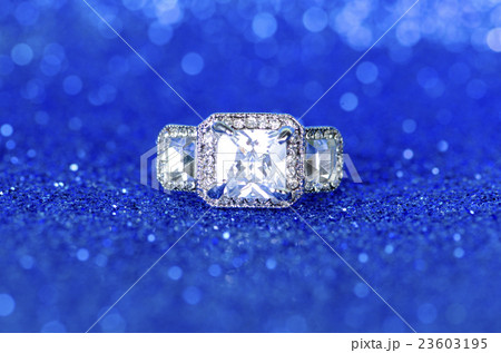 Jewellery ring against blue background Jewellery ring against blue background 23603195