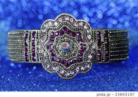 Jewellery ring against blue background 23603197