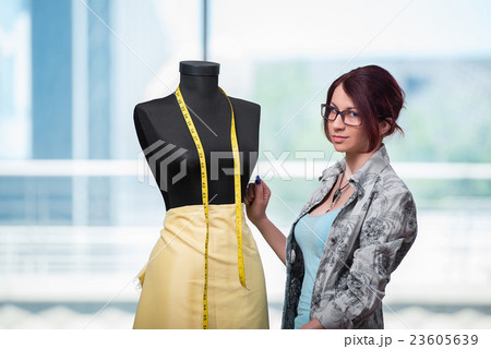 Woman tailor working on new clothing 23605639