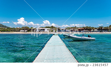 Dock in beautiful blue sea under a clear sky. Dock in beautiful blue sea under a clear sky. 23615457