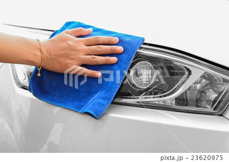 Hand with microfiber cloth cleaning car Hand with microfiber cloth cleaning car 23620975